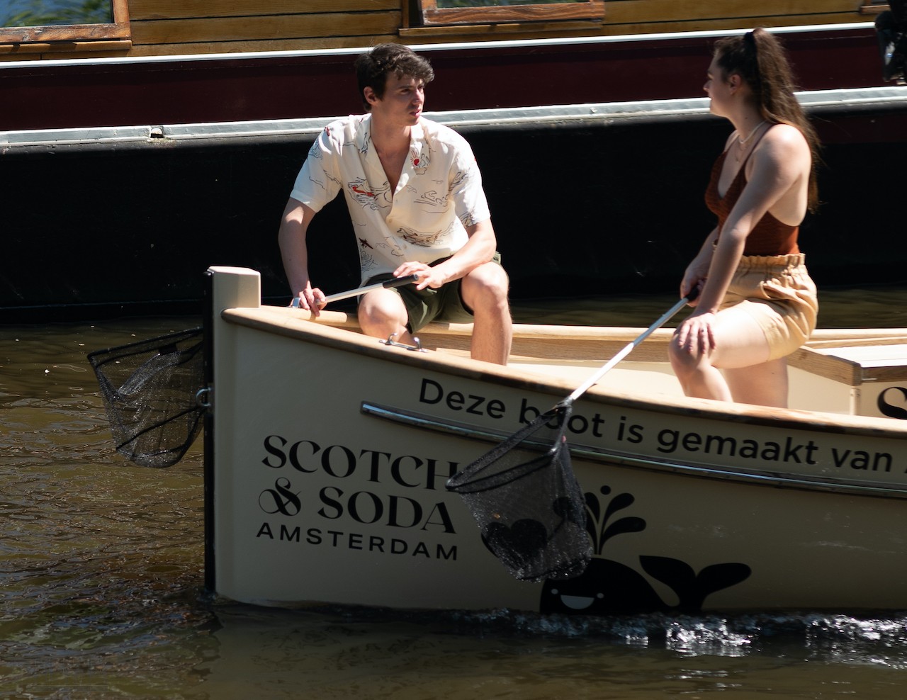 Plastic fishing on the canals of Amsterdam on The Free Spirit, the Scotch & Soda x Plastic Whale boat.jpg